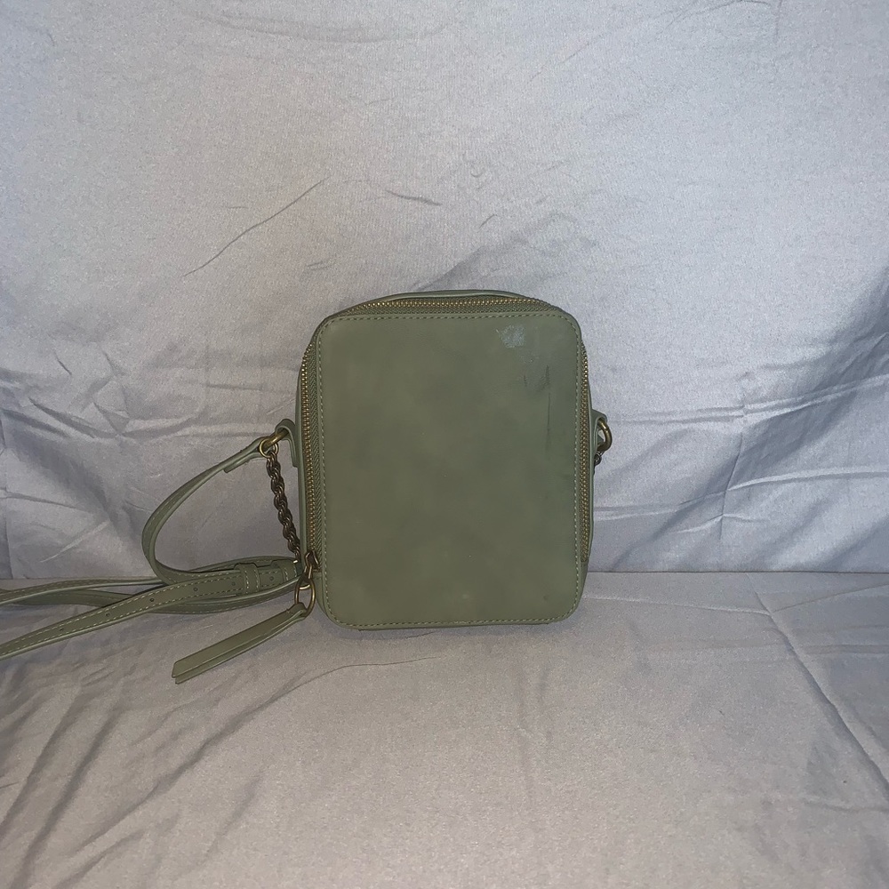 Green purse, it has one small pocket inside